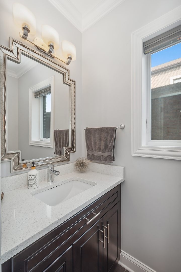 3301 South Racine Avenue Chicago, IL 60608 - Photo 21 of 32 a bathroom with a sink and a mirror