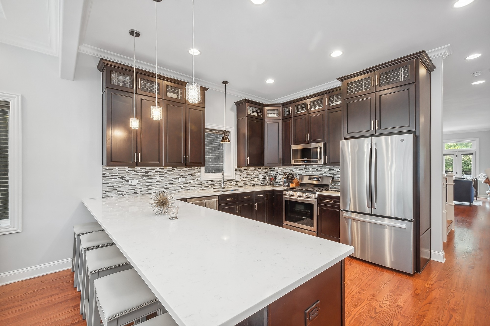 3301 South Racine Avenue Chicago, IL 60608 - Photo 4 of 32 a kitchen with stainless steel appliances a refrigerator and a stove top oven