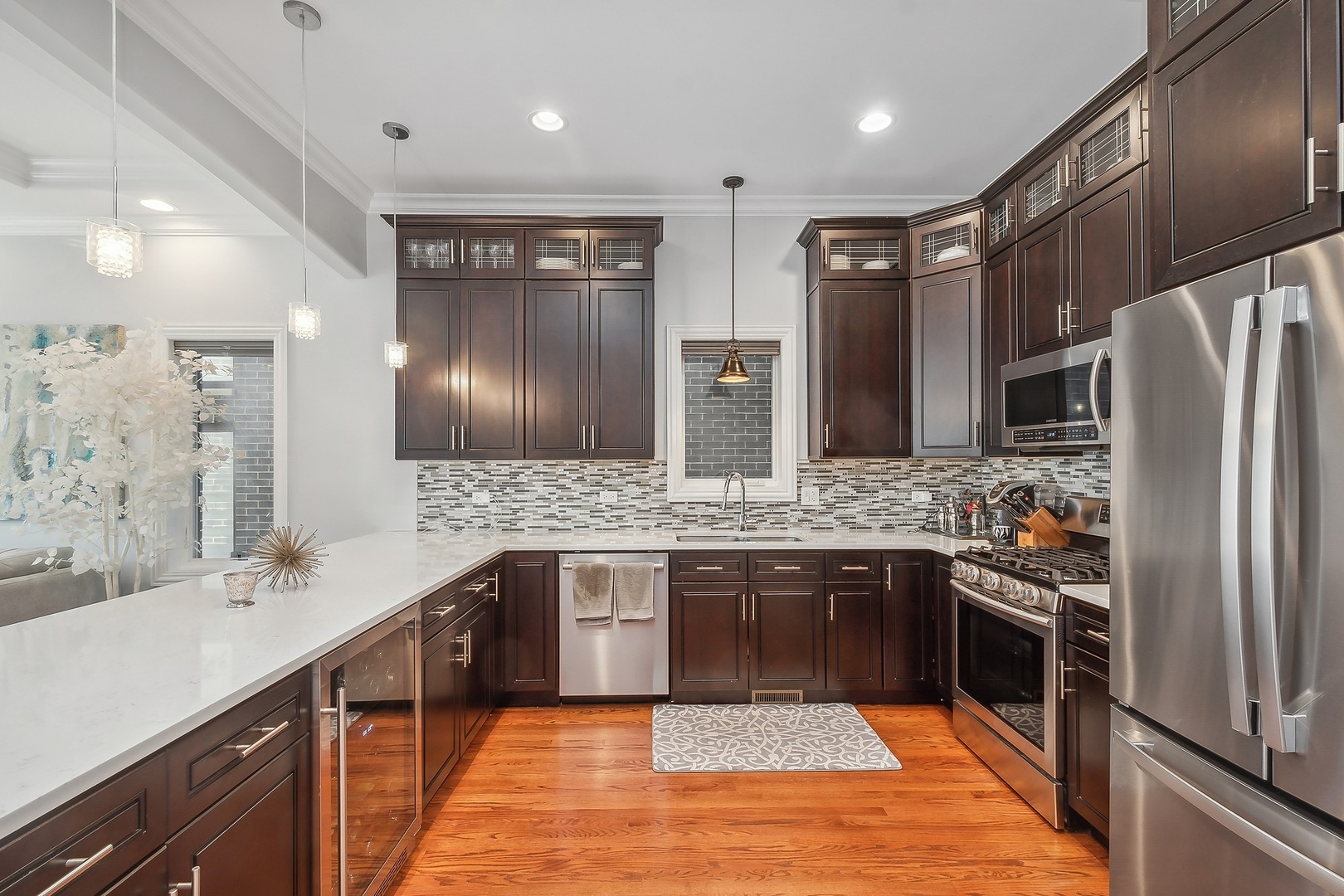 3301 South Racine Avenue Chicago, IL 60608 - Photo 6 of 32 a large kitchen with a large counter top stainless steel appliances and sink