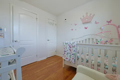 a bedroom with two beds and painted walls