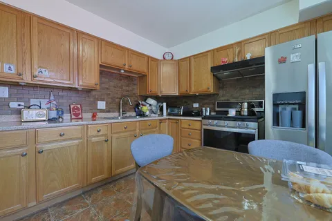 a kitchen with cabinets and window