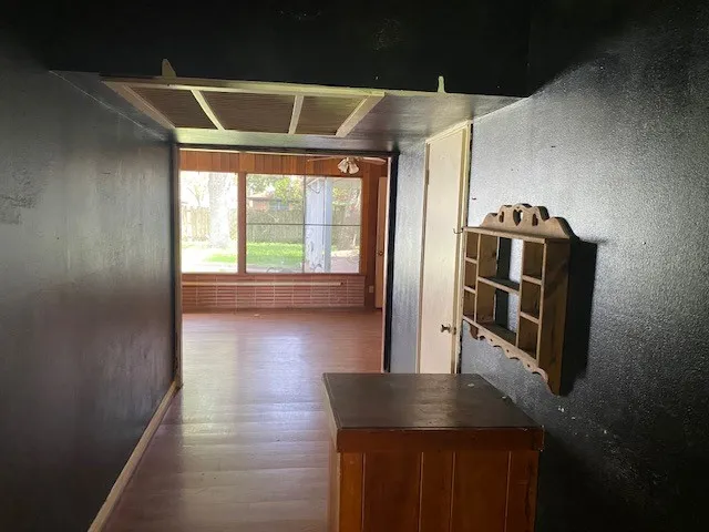 a kitchen with stainless steel appliances granite countertop a refrigerator a stove and a wooden floors