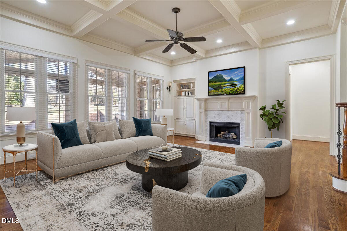 12820 River Dance Drive Raleigh, NC 27613 - Photo 12 of 86 a living room with furniture a window and a fireplace