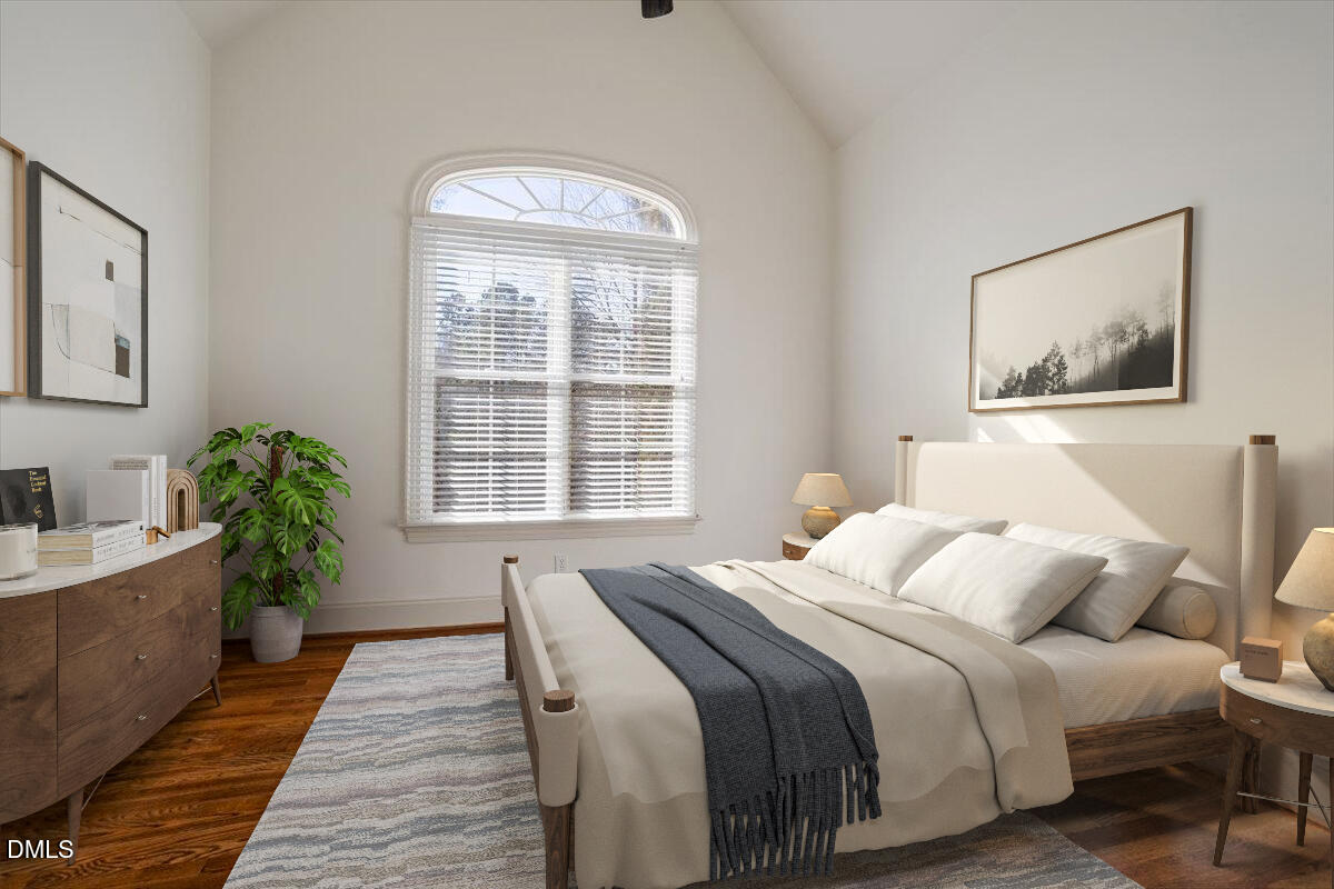 12820 River Dance Drive Raleigh, NC 27613 - Photo 37 of 86 a bedroom with a bed and a large window