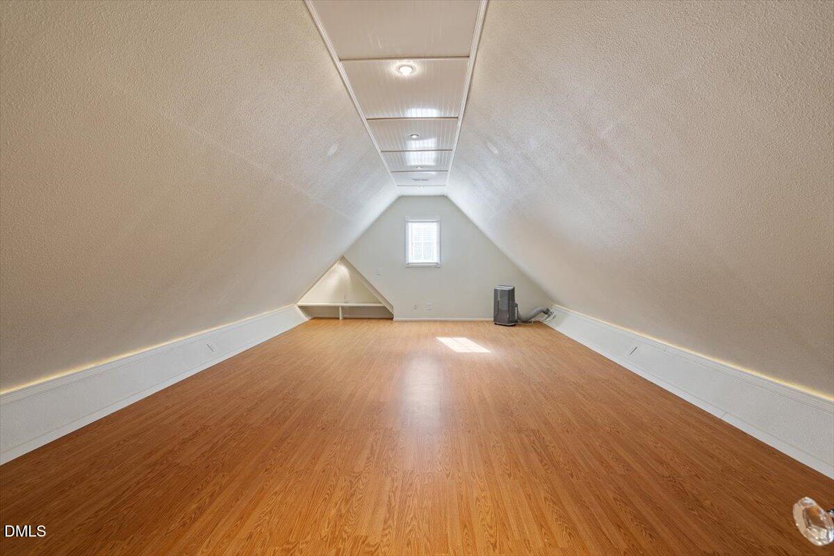 12820 River Dance Drive Raleigh, NC 27613 - Photo 54 of 86 a view of empty room with wooden floor