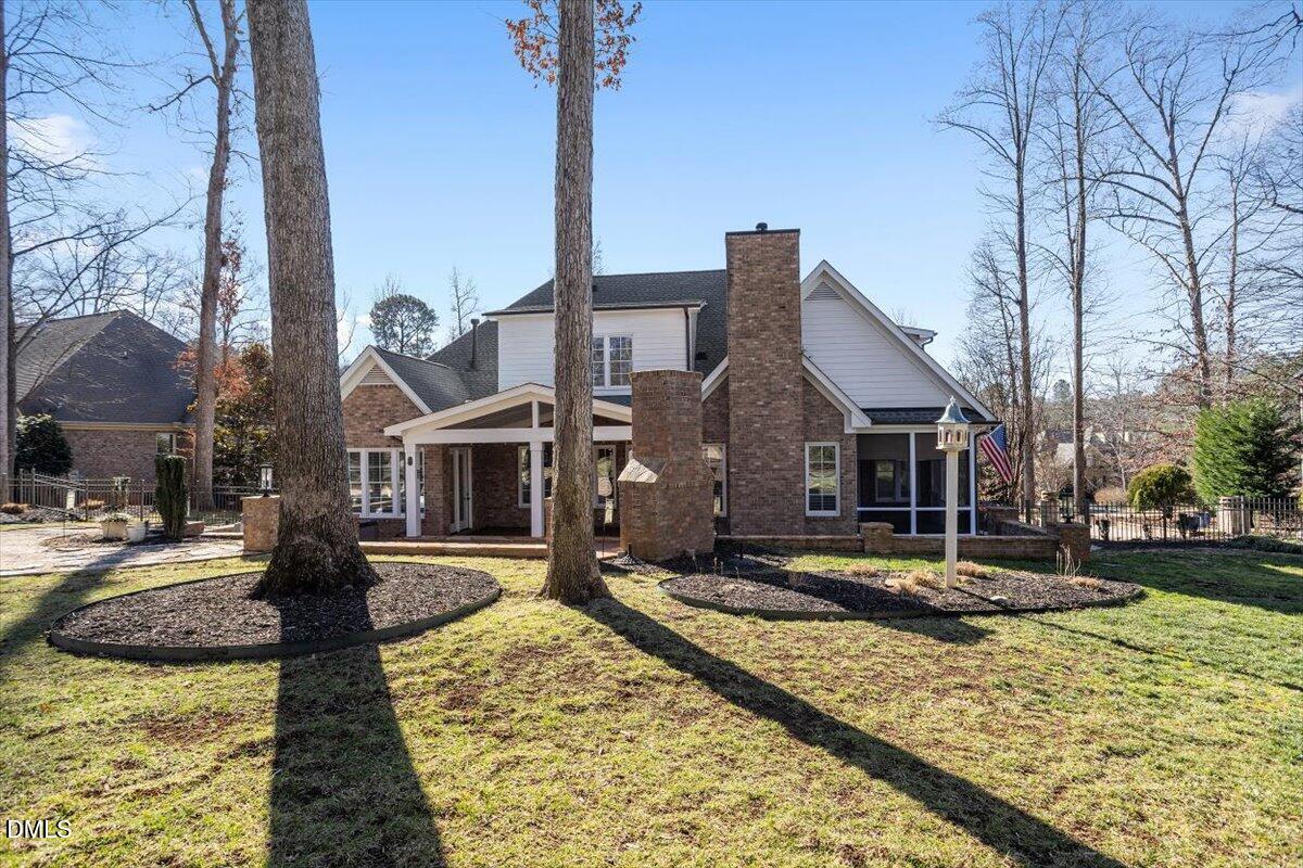 12820 River Dance Drive Raleigh, NC 27613 - Photo 67 of 86 a front view of a house with garden