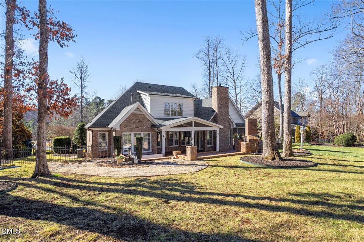 12820 River Dance Drive Raleigh, NC 27613 - Photo 68 of 86 a front view of a building with a yard