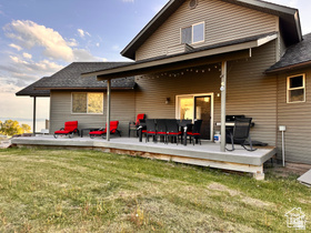 1940 East Shore Road St. Charles, ID 83272 - Photo 54 of 64 Rear view of property featuring a lawn