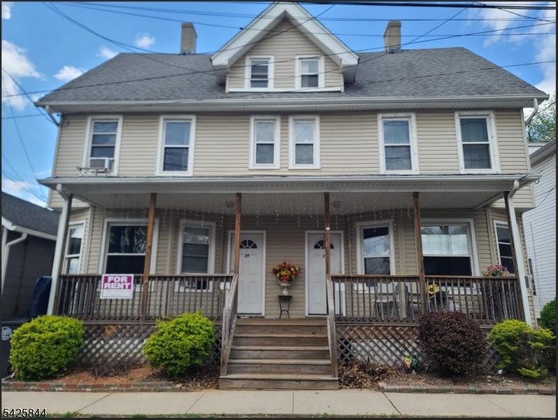 31 John Street Bound Brook, NJ 08805 - Photo 1 of 1 a front view of a house with a yard