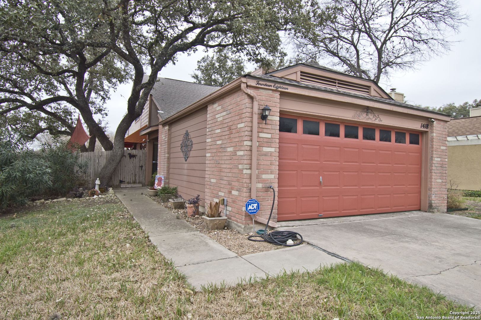 1418 Brook Meadow San Antonio, TX 78232 - Photo 1 of 1 a front view of a house with a yard
