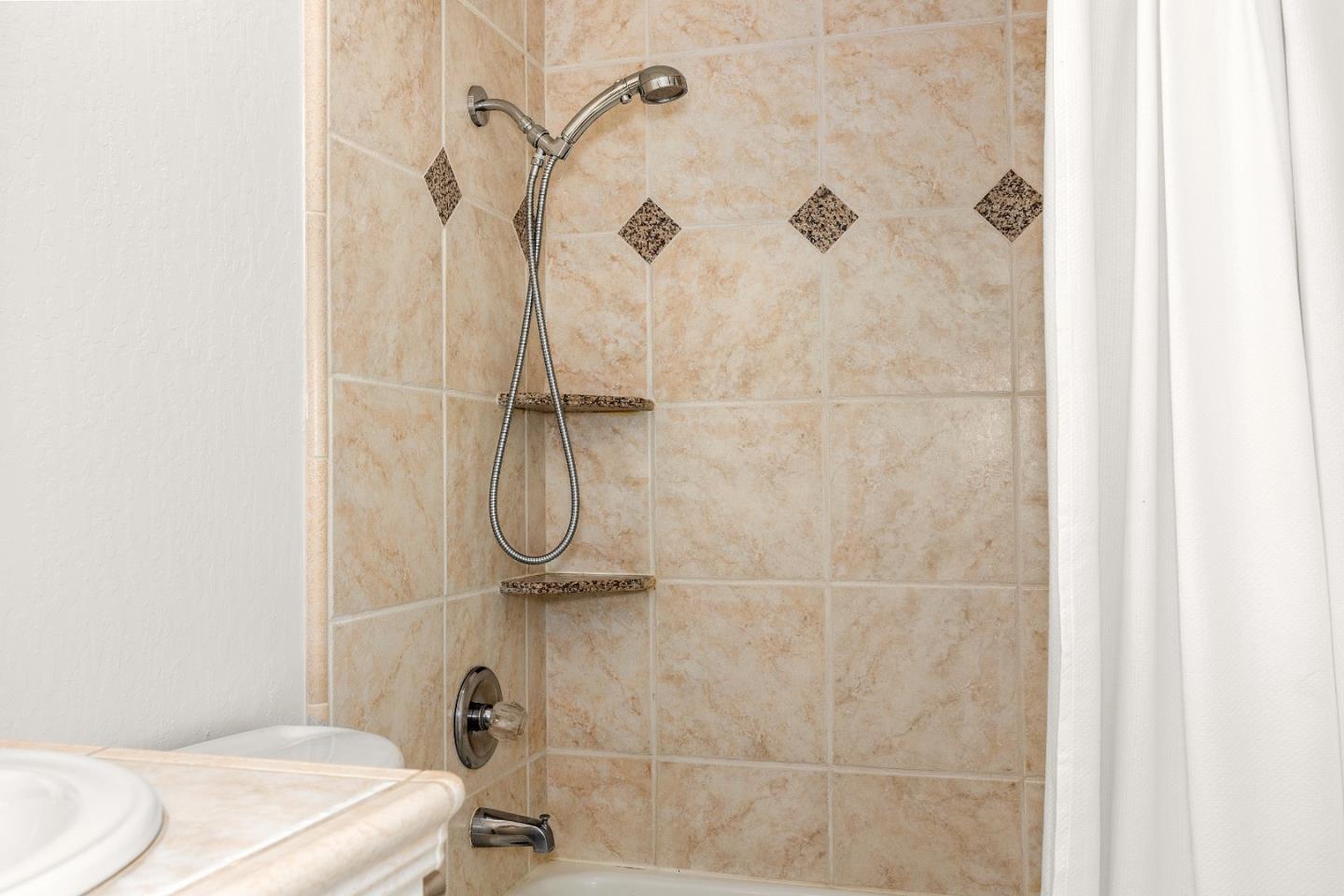 230 Rio Del Mar Boulevard, Unit K Aptos, CA 95003 - Photo 21 of 29 a bathroom with a granite countertop shower