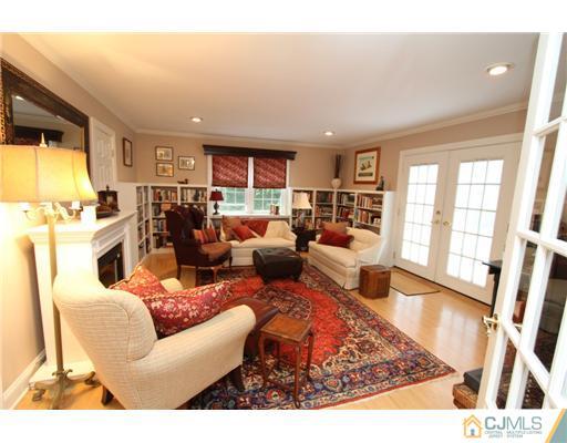 386 Plainfield Road Edison, NJ 08820 - Photo 8 of 17 a living room with furniture and a flat screen tv