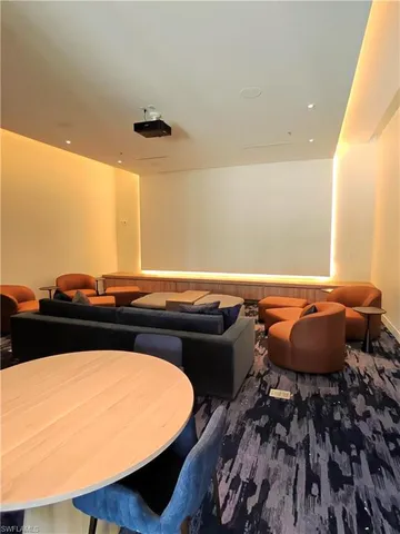 a living room with couches chairs and a coffee table