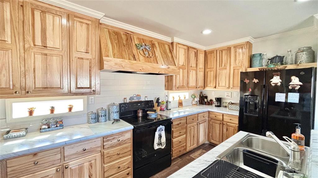 269 Apache Quitman, TX 75783 - Photo 17 of 40 a kitchen with a sink stove and cabinets