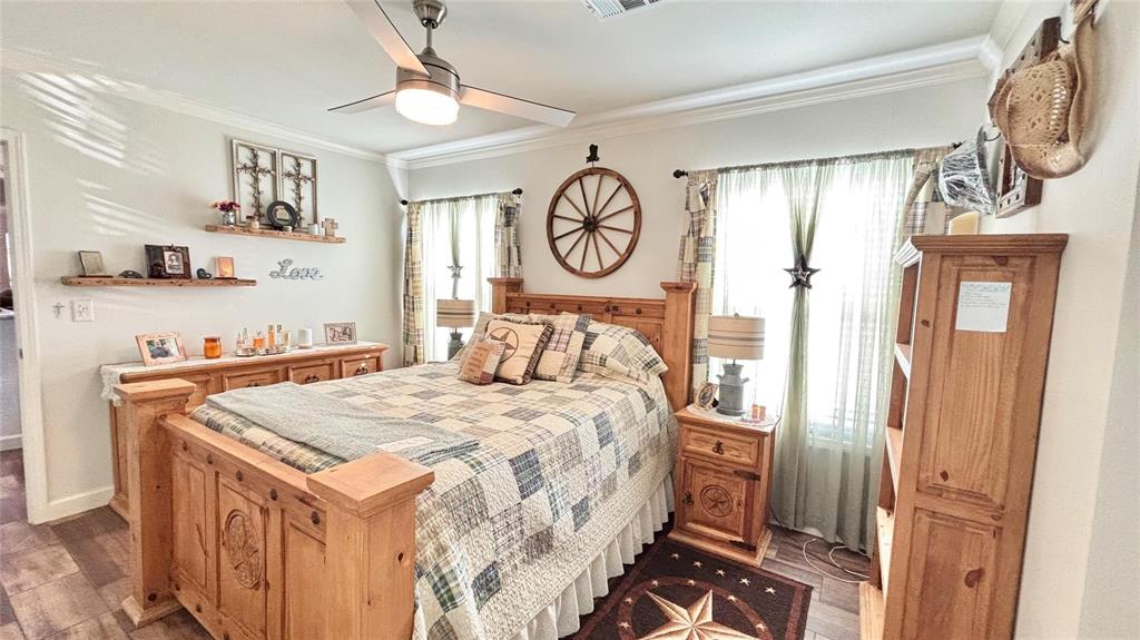 269 Apache Quitman, TX 75783 - Photo 23 of 40 a bedroom with a bed and a chandelier