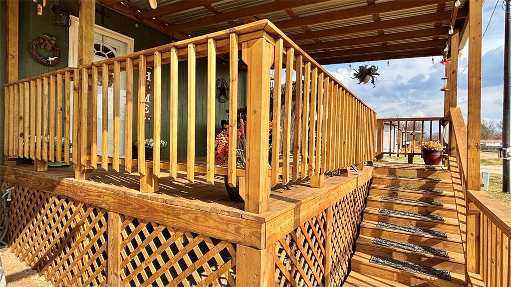 269 Apache Quitman, TX 75783 - Photo 3 of 40 a view of a porch with wooden floor and outdoor space