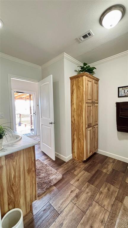 269 Apache Quitman, TX 75783 - Photo 9 of 40 a view of empty room with wooden floor and fan