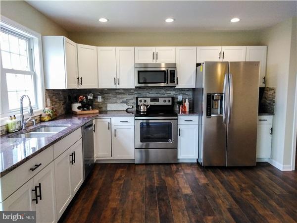 125 Bridle Path Road Front Royal, VA 22630 - Photo 2 of 6 a kitchen with stainless steel appliances a refrigerator sink and microwave
