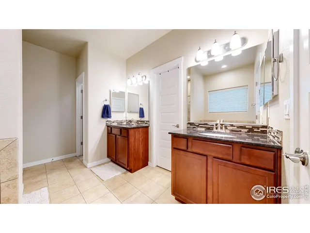 a bathroom with a sink a vanity and mirror