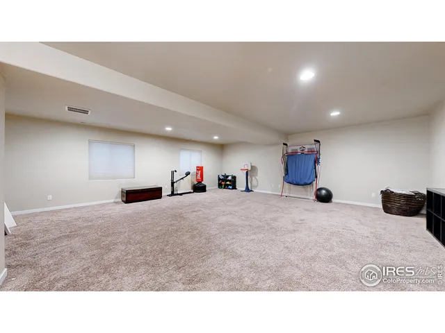 a kitchen with a refrigerator and a sink