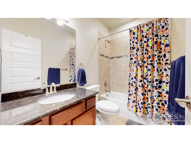 a bathroom with a sink toilet a mirror and shower