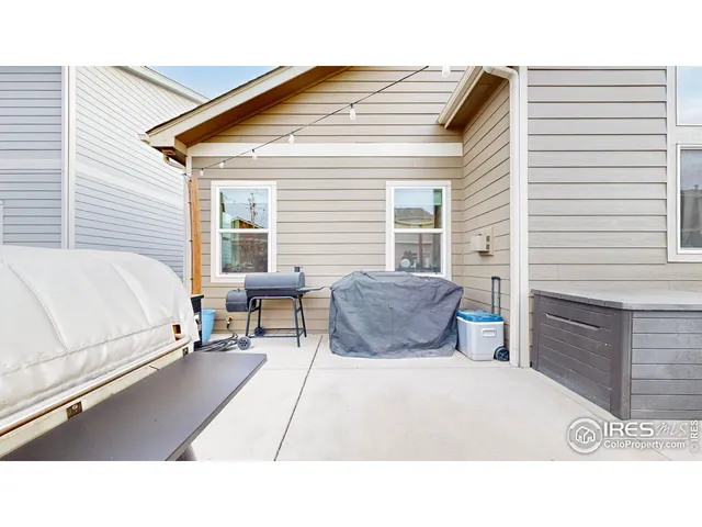 a balcony with furniture and a potted plant