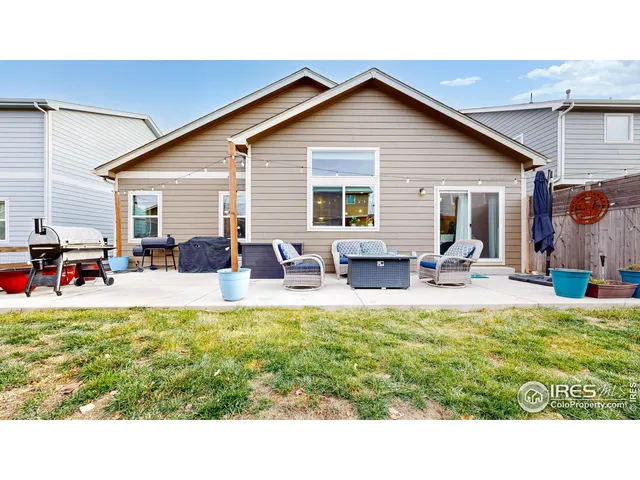 a swimming pool view with a outdoor seating