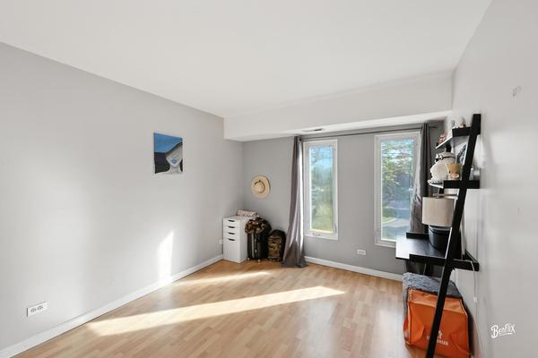 1425 Sandpebble Drive, Unit 340 Wheeling, IL 60090 - Photo 12 of 14 a view of livingroom with furniture and windows