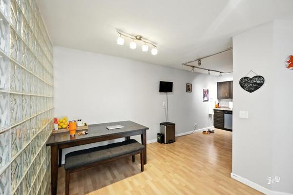 1425 Sandpebble Drive, Unit 340 Wheeling, IL 60090 - Photo 6 of 14 a bedroom with furniture and a chandelier