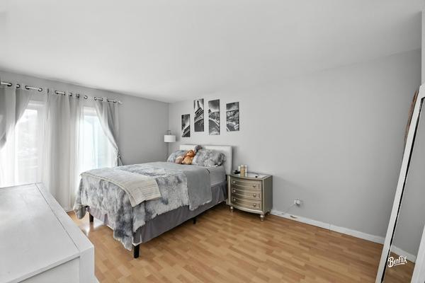 1425 Sandpebble Drive, Unit 340 Wheeling, IL 60090 - Photo 10 of 14 a bedroom with a bed and a window