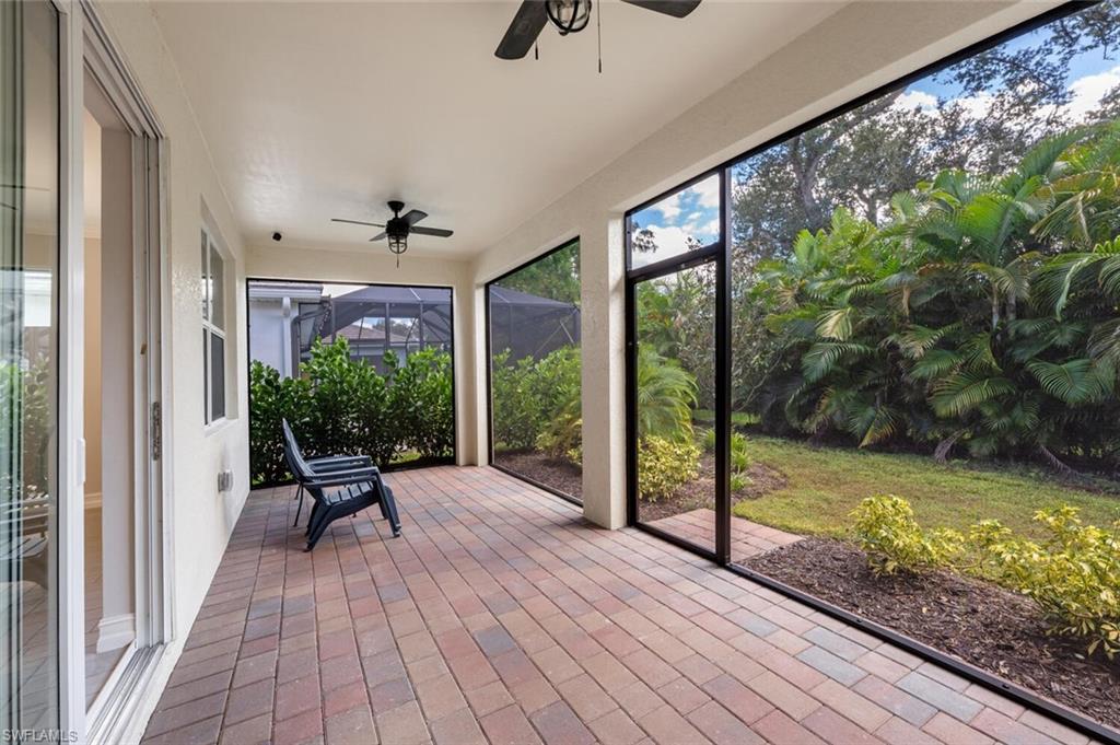 388 Grace Bay Lane Naples, FL 34114 - Photo 20 of 39 Unfurnished sunroom featuring a ceiling fan and plenty of natural light