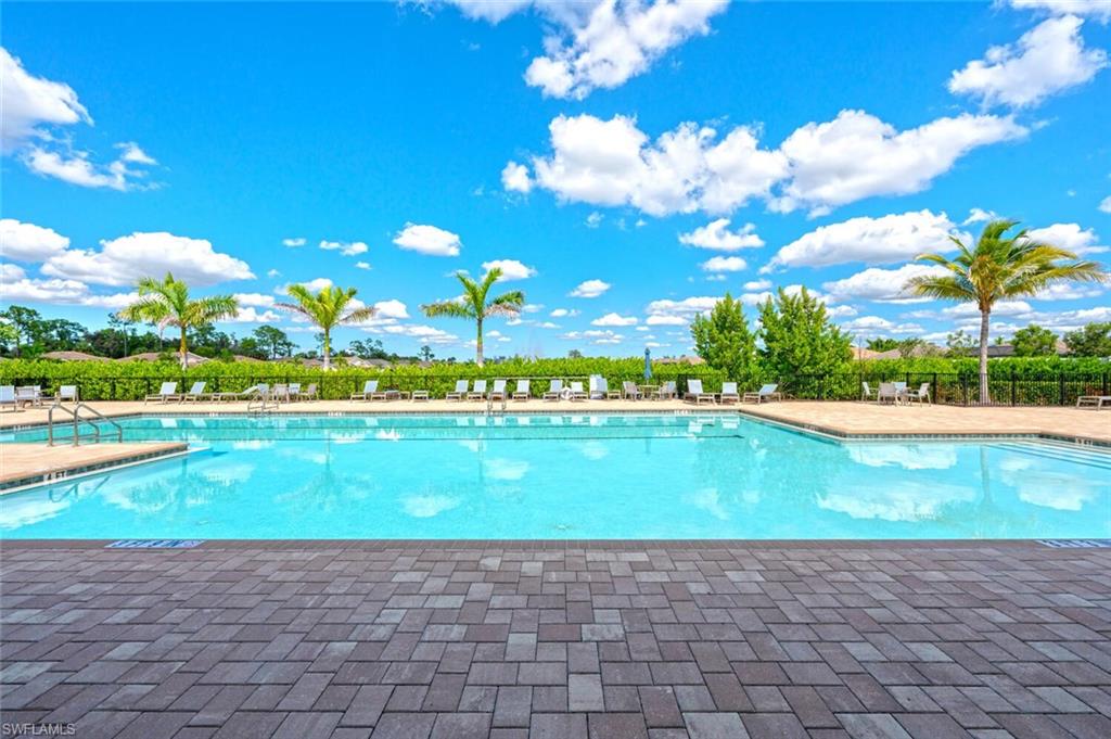 388 Grace Bay Lane Naples, FL 34114 - Photo 26 of 39 Community pool with a patio area