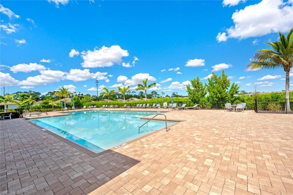 388 Grace Bay Lane Naples, FL 34114 - Photo 27 of 39 Community pool with a patio area