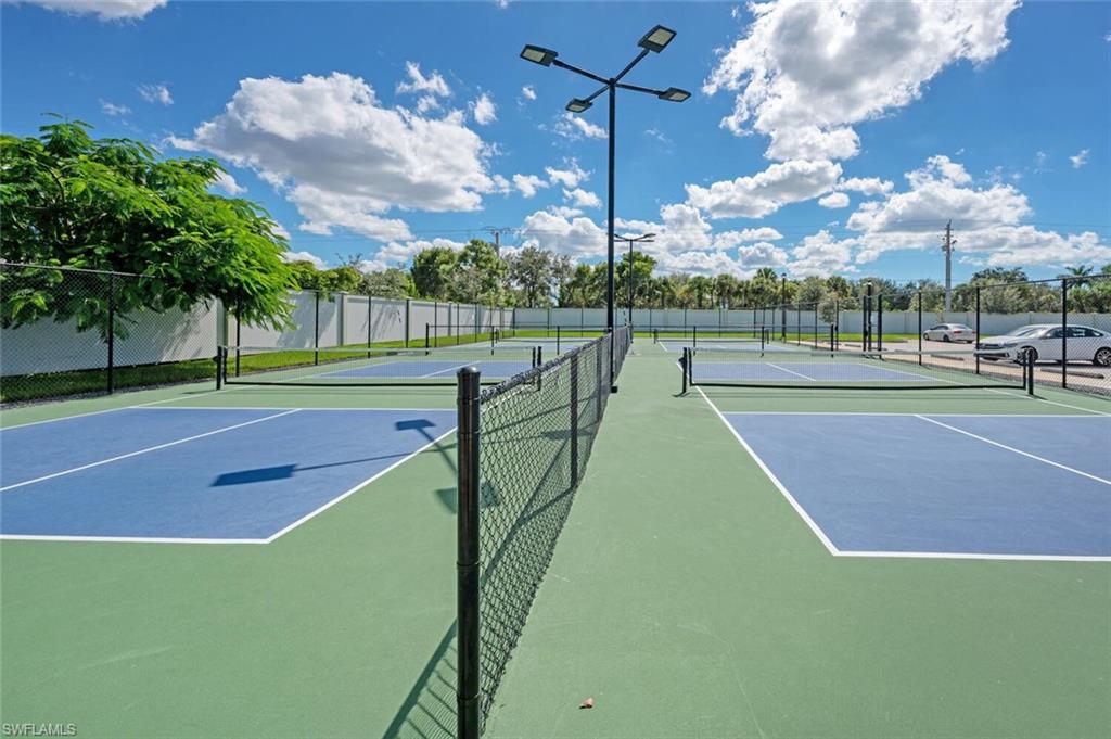 388 Grace Bay Lane Naples, FL 34114 - Photo 30 of 39 View of tennis court featuring community basketball court