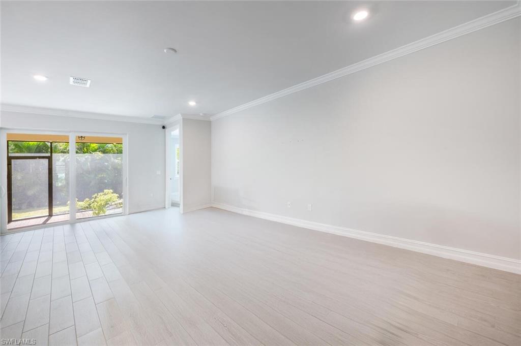 388 Grace Bay Lane Naples, FL 34114 - Photo 4 of 39 Spare room featuring ornamental molding, light wood-type flooring, and recessed lighting