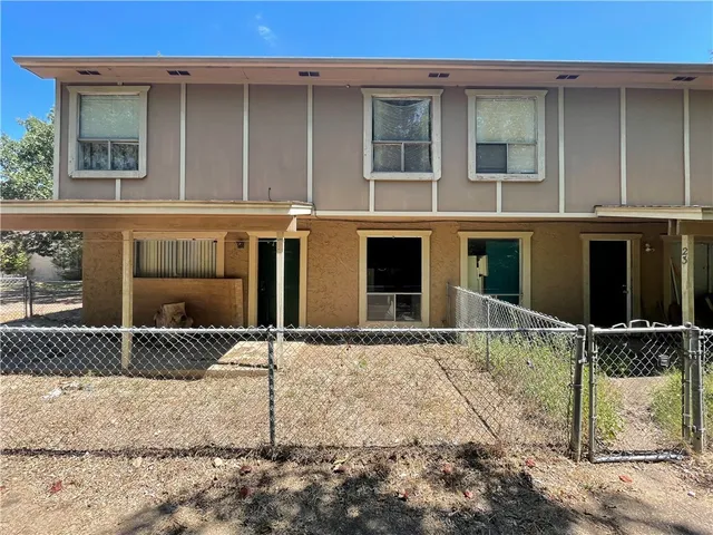 a house with trees in front of it