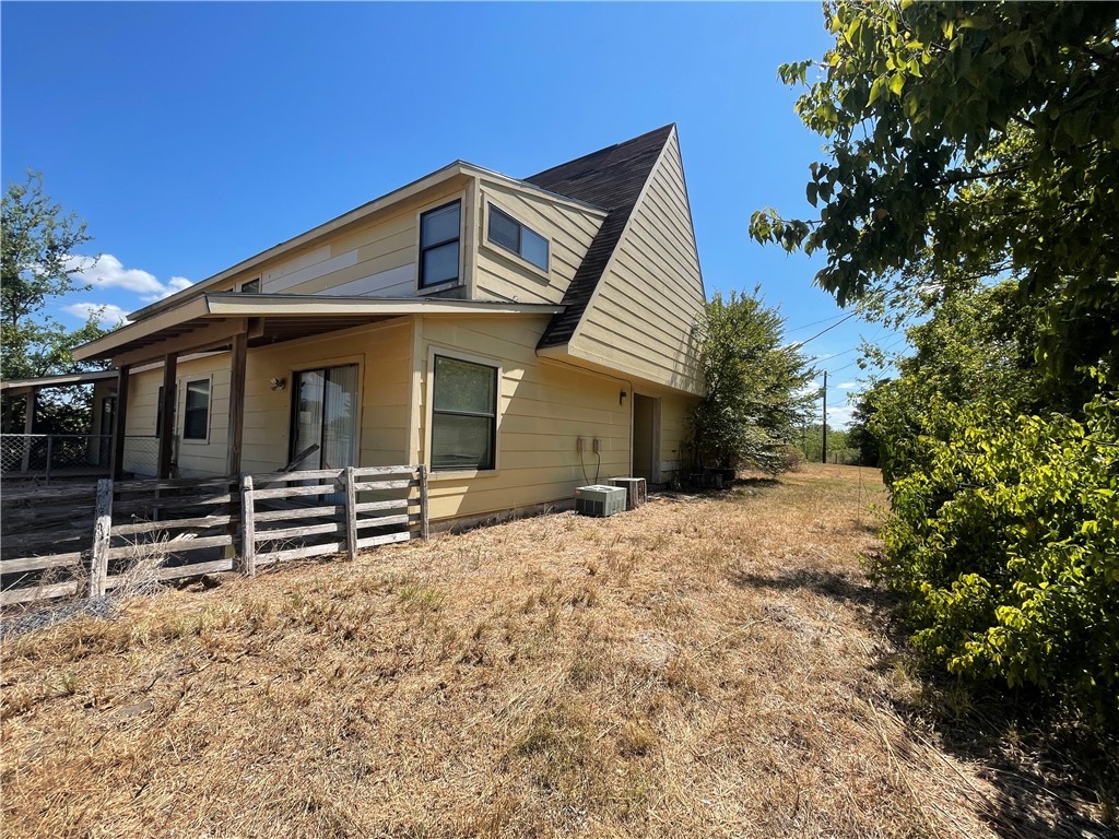 5900 Leonard Road Bryan, TX 77807 - Photo 24 of 27 a front view of a house with a yard