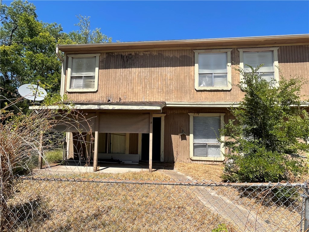 5900 Leonard Road Bryan, TX 77807 - Photo 4 of 27 a front view of a house with a garden