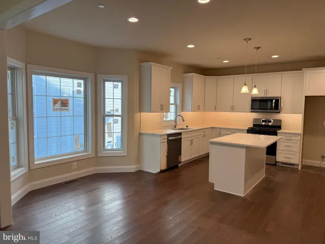 a bathroom with a toilet and a bathtub