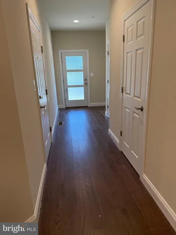 a kitchen with kitchen island granite countertop a sink and stove