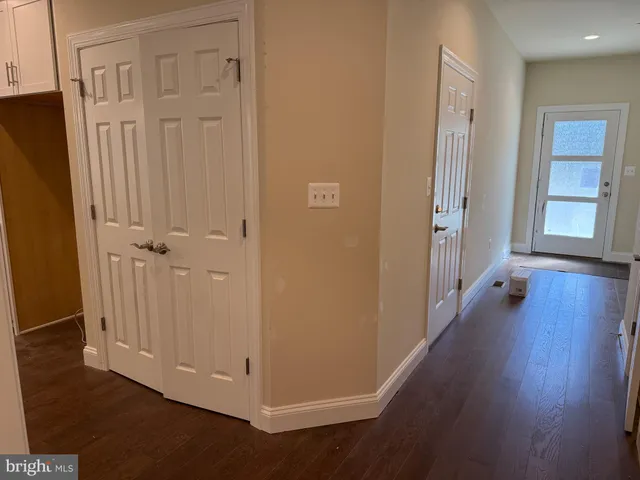 a kitchen with kitchen island a stove a sink and a refrigerator