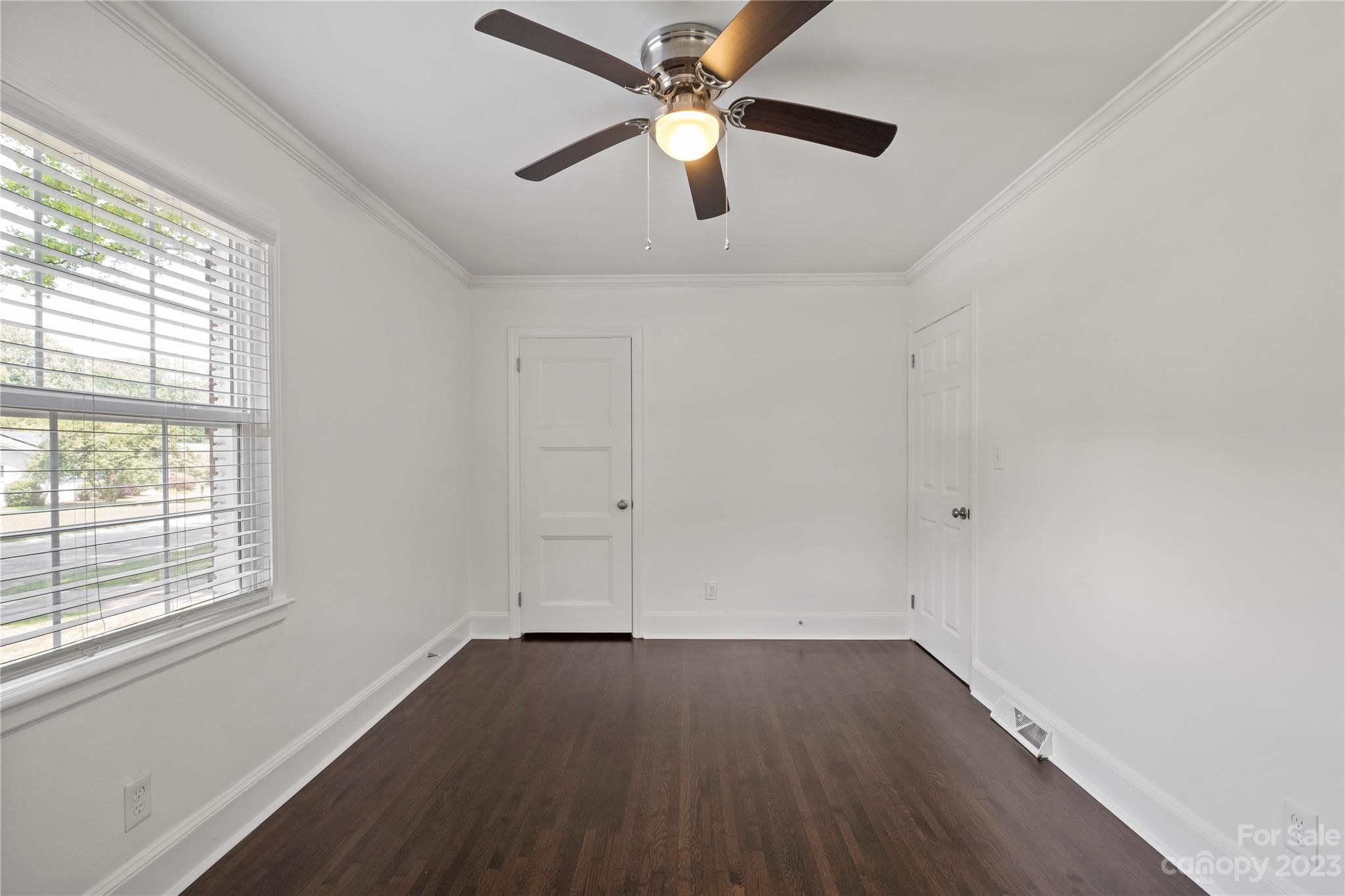 3522 Enfield Road Charlotte, NC 28205 - Photo 14 of 32 wooden floor in an empty room with a window