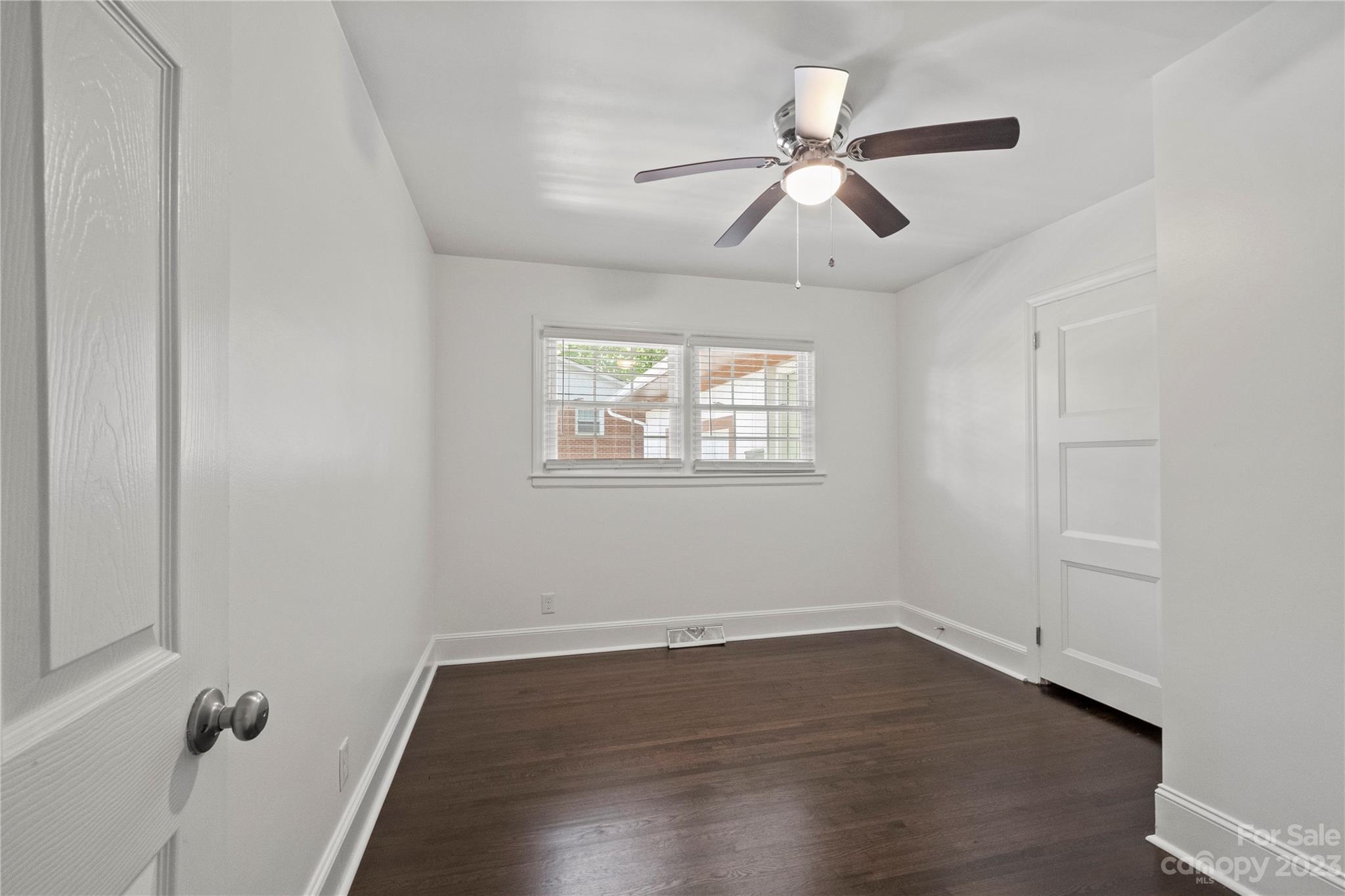 3522 Enfield Road Charlotte, NC 28205 - Photo 20 of 32 wooden floor in an empty room with a window