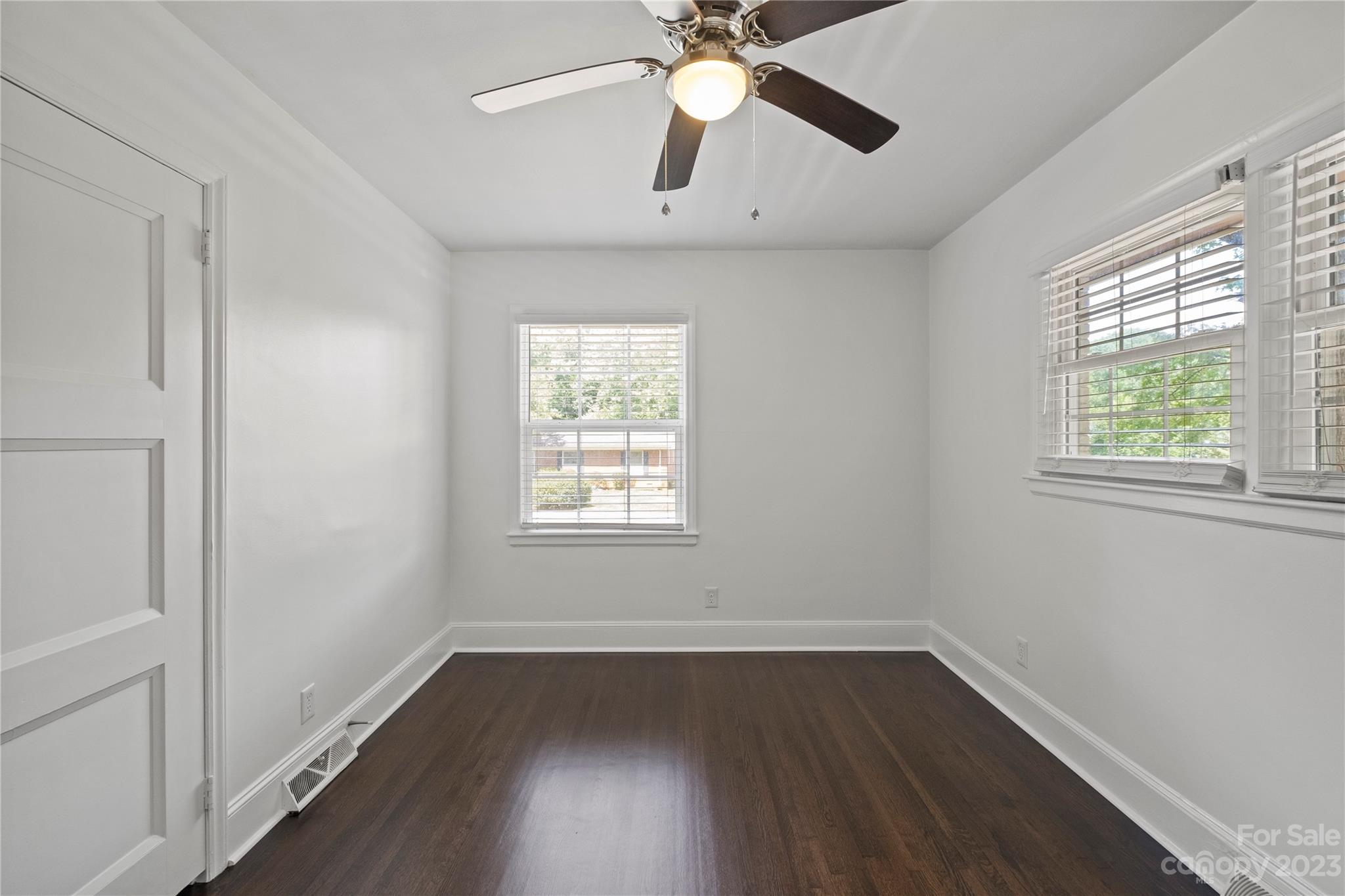 3522 Enfield Road Charlotte, NC 28205 - Photo 23 of 32 wooden floor in an empty room with a window