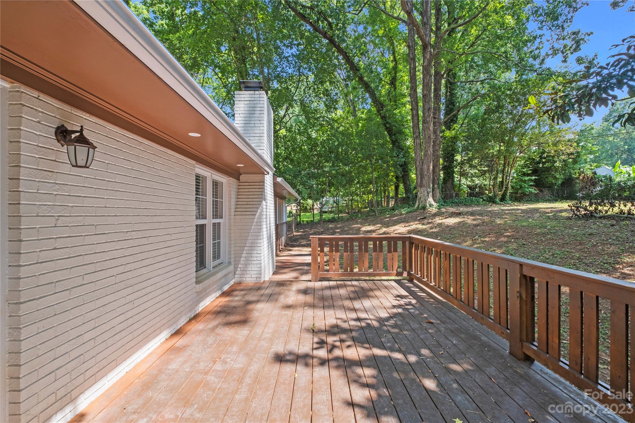3522 Enfield Road Charlotte, NC 28205 - Photo 26 of 32 a view of a balcony with wooden floor and fence