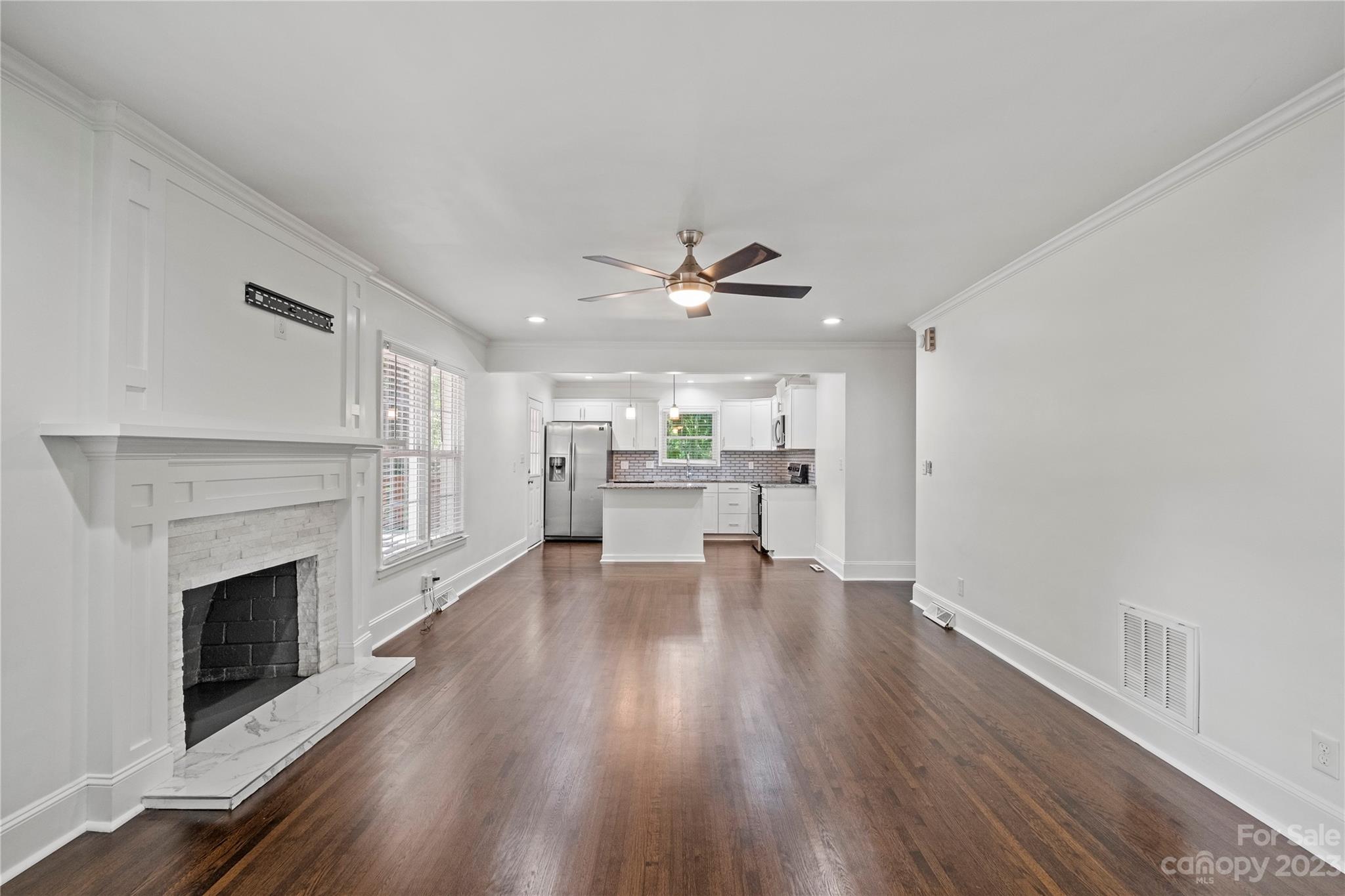3522 Enfield Road Charlotte, NC 28205 - Photo 3 of 32 a living room with furniture and a fireplace
