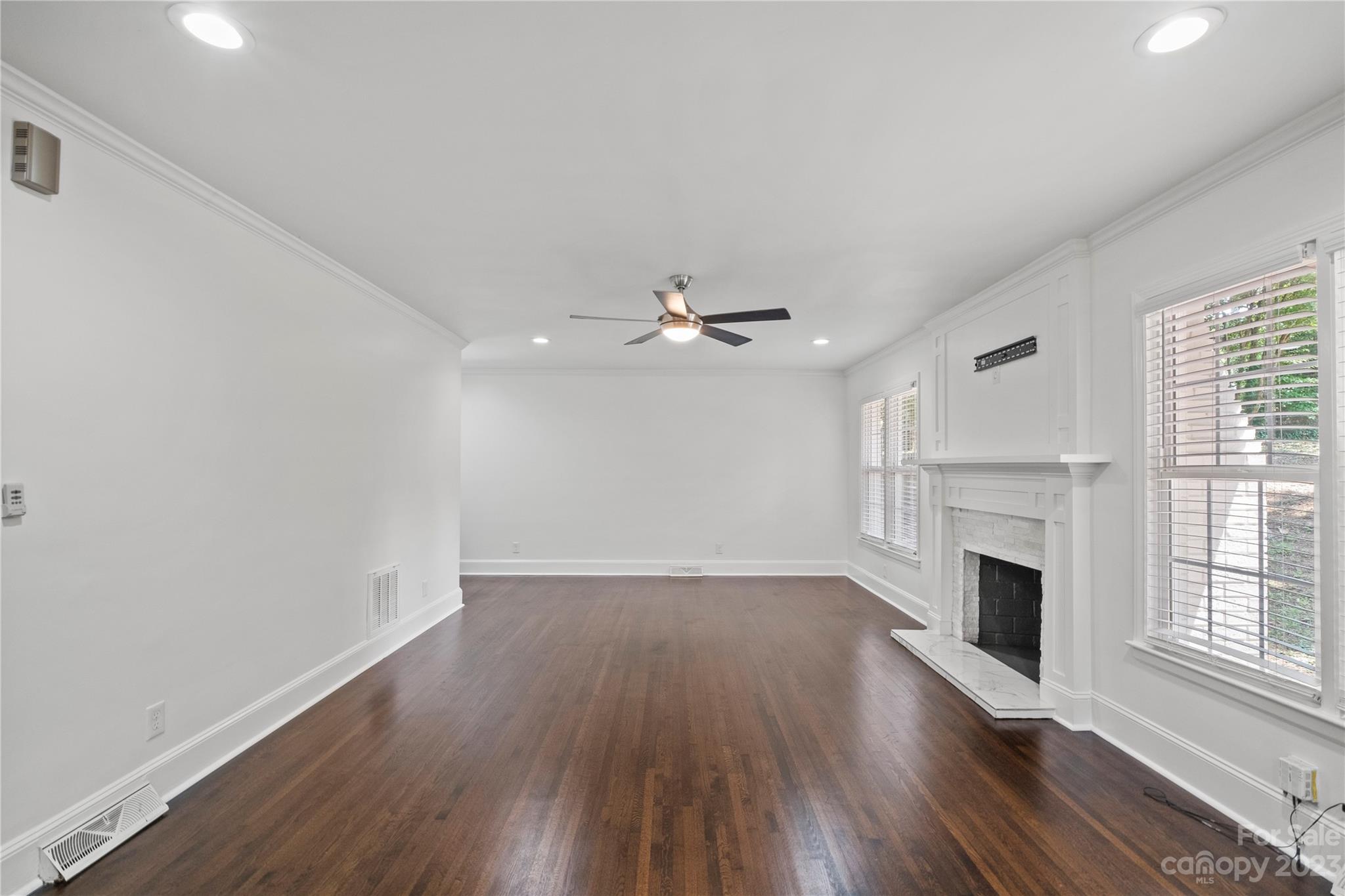 3522 Enfield Road Charlotte, NC 28205 - Photo 4 of 32 wooden floor in an empty room with a window