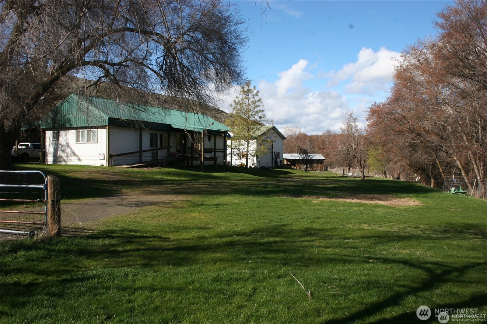 a backyard of a house with lots of green space