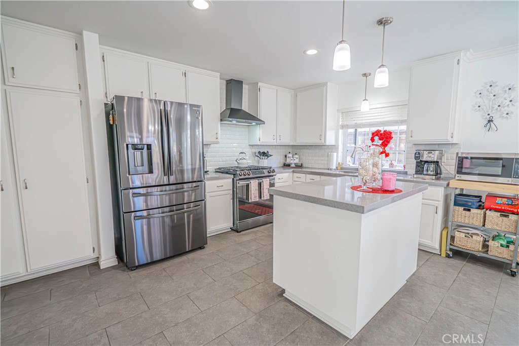 27738 Hyssop Lane Saugus, CA 91350 - Photo 15 of 43 a kitchen with refrigerator and cabinets