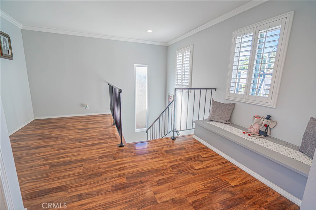 27738 Hyssop Lane Saugus, CA 91350 - Photo 21 of 43 a view of empty room with wooden floor and fan